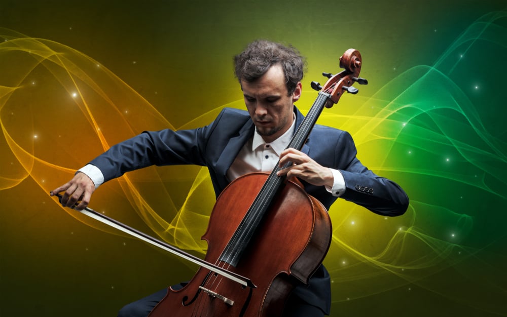 Serious classical cellist with fabled sparkling wallpaper Serious classical cellist with fabled sparkling wallpaper